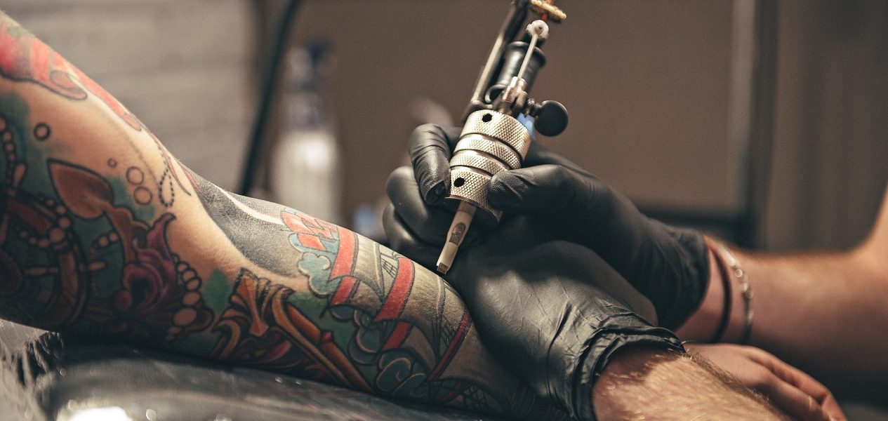 Tattoo artist working