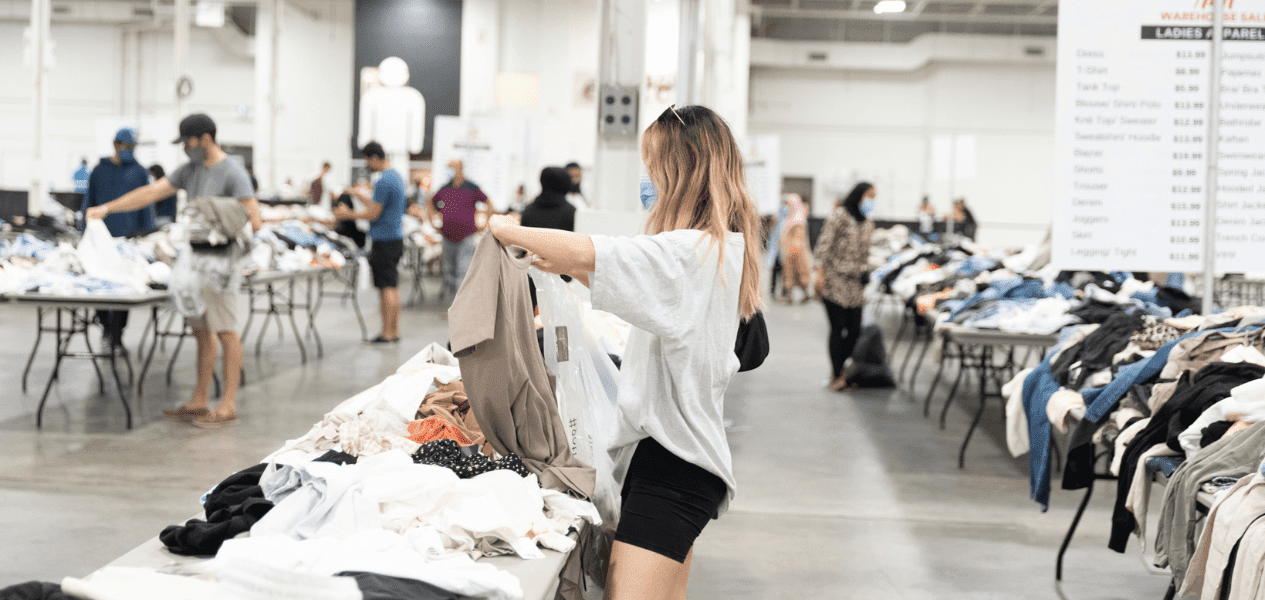 H&M Warehouse Sale Toronto - Girl picking up clothes